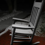 Chair dusted with snow